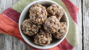 Easy chocolate marshmallow no-bake cookies in bowl with chocolate chips and coconut - simple dessert recipe photo