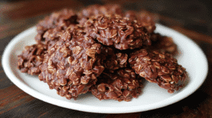 Classic No Bake Cookies with Honey made from oats, peanut butter, cocoa, and honey on a white plate