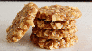 classic no bake cookies with walnuts, made from oats, peanut butter, cocoa, and crushed walnut halves.
