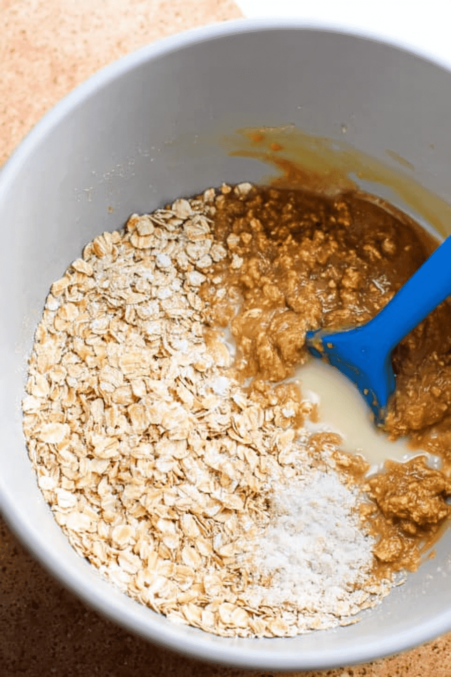 Mixing bowl with peanut butter, oats, powdered sugar, and condensed milk for no-bake cookies