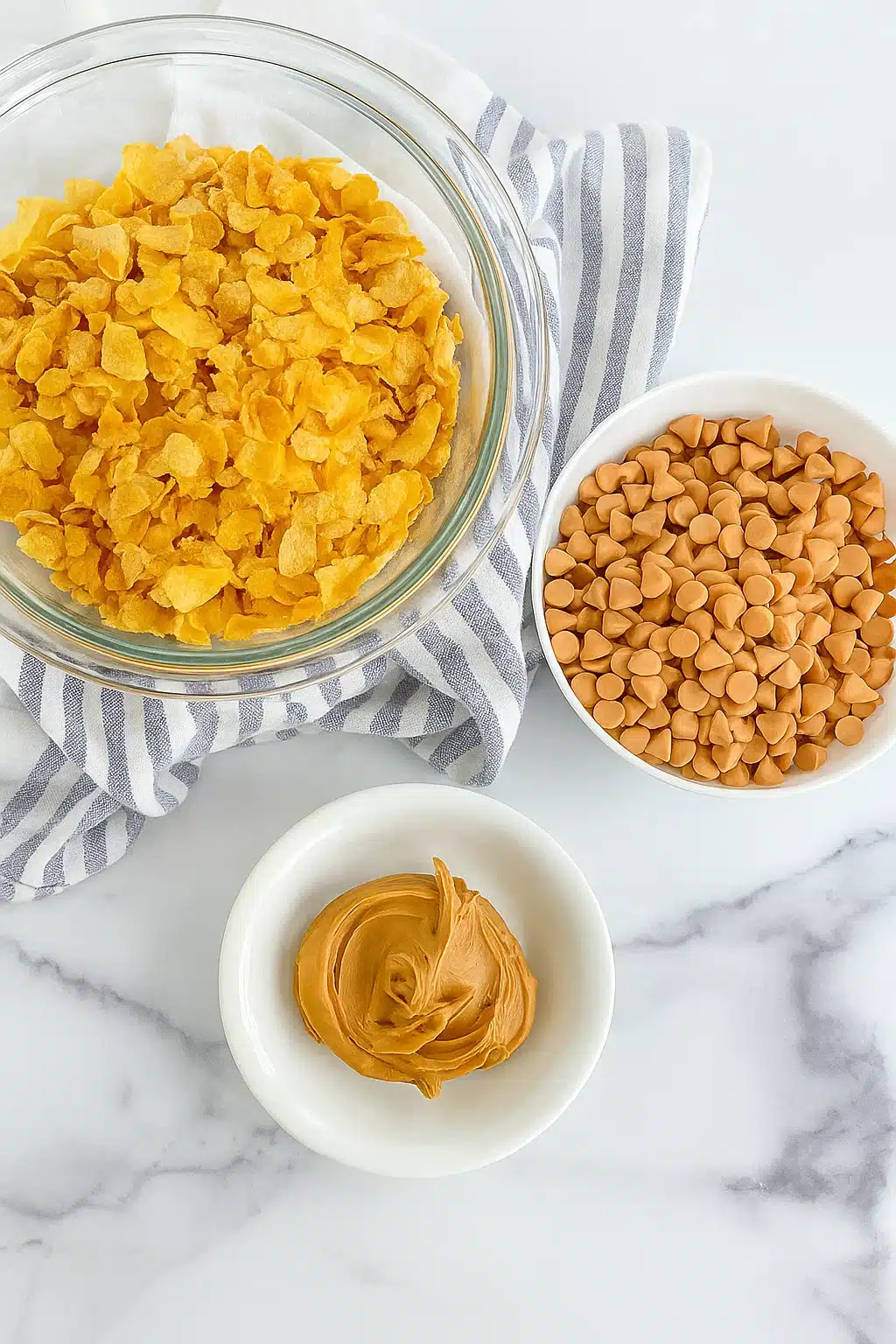no-bake-cornflake-cookies-ingredients-cornflakes-butterscotch-peanut-butter Ingredients for No Bake Cornflake Cookies Including Cornflakes, Butterscotch Chips, and Peanut Butter