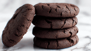 Quick Cocoa No Bake Cookies stacked on marble surface