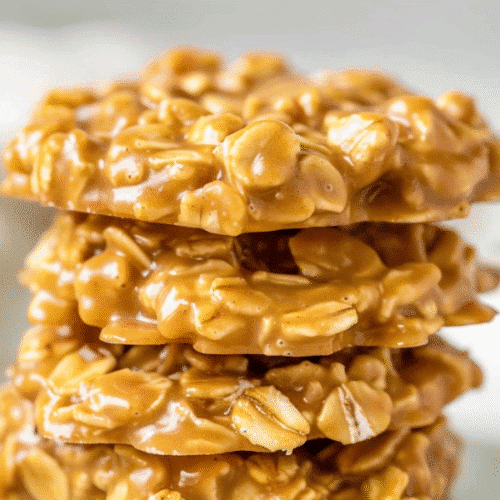 Stack of golden peanut butter no bake cookies made with corn syrup and oats