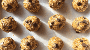 Allergy-friendly no bake bites with oats and chocolate chips on parchment paper