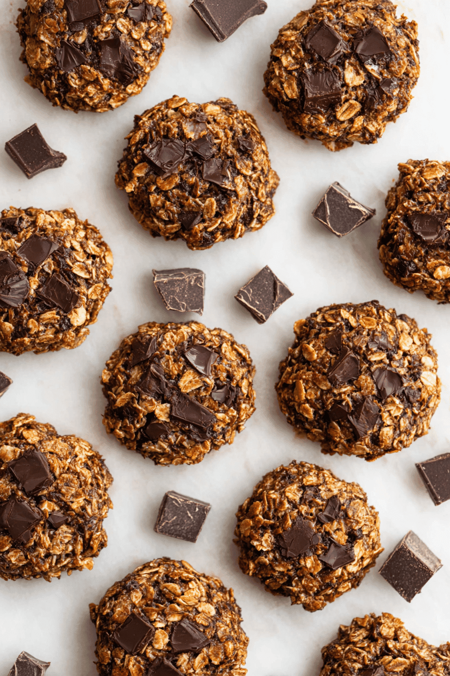 Guilt-free no-bake cookies with oats and dark chocolate chunks on marble