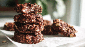 paleo no-bake cookies with nuts and coconut on parchment paper.