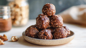 Sugar-free energy bites stacked in a rustic bowl