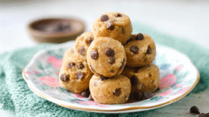 Toddler-friendly no bake snacks with nut butter and chocolate chips on a decorative plate
