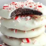 No bake peppermint bark cookies coated in white chocolate and topped with crushed candy canes