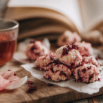 No-bake hibiscus pear cookie bites with soft floral tones and pear slices in natural light